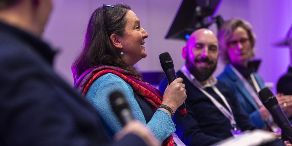 A woman speaking to a crowd
