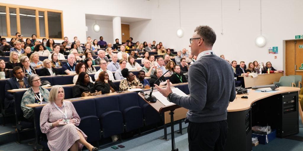 A crowd of people in a lecture theatre
