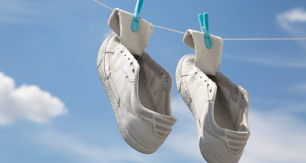 Old trainers on clothesline