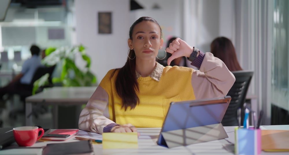 Worker showing negative gesture at job place